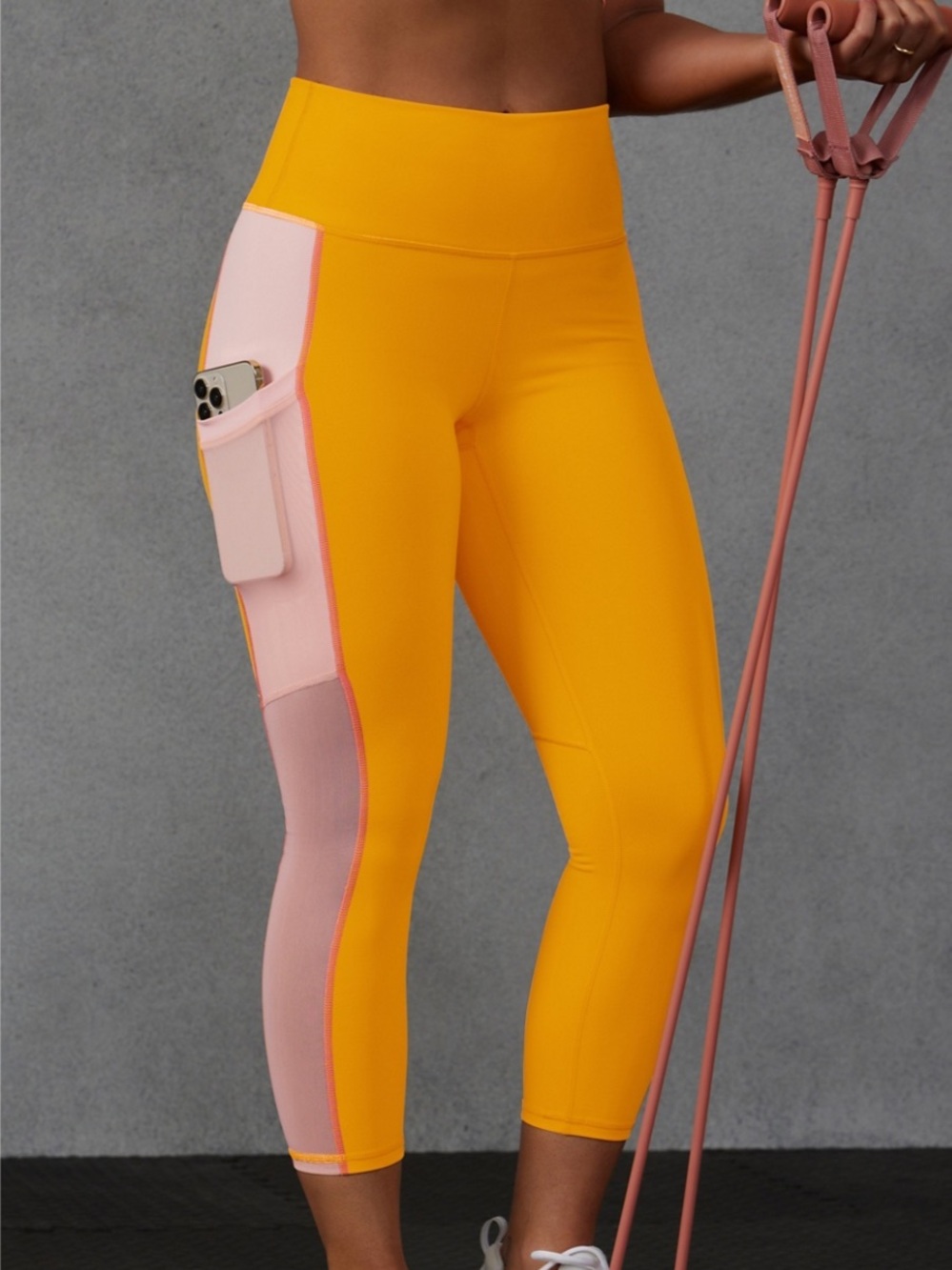 Fabletics Yellow and Pink On-The-Go PowerHold High-Waisted Capri